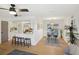 Open concept kitchen and dining area with breakfast bar, modern appliances, and hardwood floors at 3911 King Dr, Brandon, FL 33511