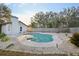 Inviting kidney-shaped pool with surrounding landscaping at 3911 King Dr, Brandon, FL 33511