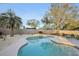Freeform swimming pool with surrounding patio and landscaping at 3911 King Dr, Brandon, FL 33511