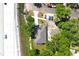 Overhead view of a gray roofed home highlighting its proximity to greenery and a road at 408 E Hanlon St, Tampa, FL 33604