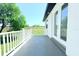Private balcony with a clean white railing, offering a serene outdoor space, adjacent to french doors at 408 E Hanlon St, Tampa, FL 33604