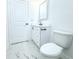 Bathroom featuring modern vanity and marble-look tile flooring at 408 E Hanlon St, Tampa, FL 33604