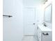 Bathroom features a white vanity, a stylish mirror, and modern fixtures at 408 E Hanlon St, Tampa, FL 33604