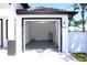 Spacious two-car garage with durable epoxy flooring and well-lit interior, perfect for storage and projects at 408 E Hanlon St, Tampa, FL 33604