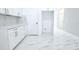 Modern kitchen showcasing white cabinets, stainless steel appliances, and sleek countertops at 408 E Hanlon St, Tampa, FL 33604