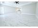 Open concept living room featuring tiled floors and views of the kitchen at 408 E Hanlon St, Tampa, FL 33604