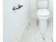 Bright bathroom with a toilet and a modern paper holder at 408 E Hanlon St, Tampa, FL 33604