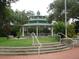 Elegant gazebo with tiered roof and benches, located in a lush green park setting at 420 5Th N St, Safety Harbor, FL 34695