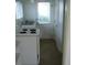 Simple kitchen with stove and sink at 420 5Th N St, Safety Harbor, FL 34695