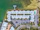 Unique top down aerial view shows the waterway on one side and community pool and waterway access on the other at 464 N Paula Dr # 322, Dunedin, FL 34698