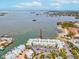 A serene and panoramic aerial view of the condo community with waterfront views at 464 N Paula Dr # 322, Dunedin, FL 34698