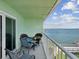 Cozy balcony with seating provides an excellent water view for relaxation and enjoying the scenic outdoors at 464 N Paula Dr # 322, Dunedin, FL 34698