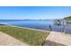 Private water access with a wooden ladder, perfect for swimming, paddle boarding, and boating adventures at 464 N Paula Dr # 322, Dunedin, FL 34698