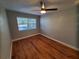 Bright bedroom with wood floors and ceiling fan at 4818 10Th S Ave, St Petersburg, FL 33711