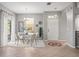 Modern dining area with glass table and neutral decor near entry at 5128 6Th N Way, St Petersburg, FL 33703