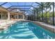 Inviting swimming pool with a screened enclosure and spacious patio at 5264 61St S Ave, St Petersburg, FL 33715