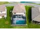 Overhead view of a house with a screened-in pool and backyard at 8409 Dove Bog Ter, Parrish, FL 34219