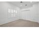 Bright bedroom features neutral carpet, large closet, and window with white shutters at 10106 Radcliffe Dr, Tampa, FL 33626
