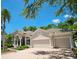 Charming home featuring a tile roof, brick driveway, attached two-car garage, manicured landscaping, and a covered front porch at 10106 Radcliffe Dr, Tampa, FL 33626