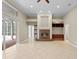 Open living room featuring a fireplace and sliding glass doors to the backyard at 10106 Radcliffe Dr, Tampa, FL 33626