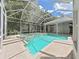 Backyard pool and spa area with screened enclosure at 10106 Radcliffe Dr, Tampa, FL 33626