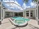 Backyard pool and hot tub with screened enclosure at 10106 Radcliffe Dr, Tampa, FL 33626