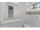 Modern bathroom with a sleek vanity, frameless glass shower, and contemporary fixtures at 10639 Ruffino Ct, Trinity, FL 34655