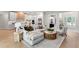 Bright, open living space features a comfortable sectional, modern decor, and seamless flow to the kitchen at 10639 Ruffino Ct, Trinity, FL 34655