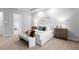 Beautiful main bedroom with neutral tones, carpet, and stylish décor offers a tranquil retreat at 10639 Ruffino Ct, Trinity, FL 34655