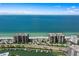Aerial view showcasing waterfront property, boat slips, and ocean access at 1660 Gulf Blvd # 706, Clearwater Beach, FL 33767