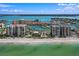 Aerial view of luxurious beachfront condo building with marina at 1660 Gulf Blvd # 706, Clearwater Beach, FL 33767