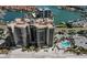 Aerial view of beachfront condo building with pool at 1660 Gulf Blvd # 706, Clearwater Beach, FL 33767