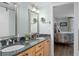 Double vanity bathroom with granite countertops and elegant mirrors at 1660 Gulf Blvd # 706, Clearwater Beach, FL 33767