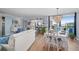 Bright dining room with white table and chandelier at 1660 Gulf Blvd # 706, Clearwater Beach, FL 33767