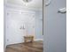 Bright entryway with white doors and a wooden bench at 1660 Gulf Blvd # 706, Clearwater Beach, FL 33767