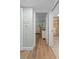 Hallway with light walls and wood flooring leading to bedrooms and bath at 1660 Gulf Blvd # 706, Clearwater Beach, FL 33767