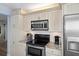 Well-equipped kitchen with stainless steel appliances and granite countertops at 1660 Gulf Blvd # 706, Clearwater Beach, FL 33767