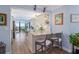Updated kitchen with granite countertops, white cabinets, and breakfast bar at 1660 Gulf Blvd # 706, Clearwater Beach, FL 33767