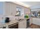 Kitchen features granite countertops, stainless steel appliances, and updated cabinetry at 1660 Gulf Blvd # 706, Clearwater Beach, FL 33767