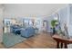 Spacious living room with hardwood floors and coastal decor at 1660 Gulf Blvd # 706, Clearwater Beach, FL 33767
