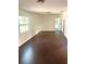 Bright bedroom with dark hardwood floors at 18415 Geraldine Rd, Dade City, FL 33523