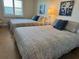 Guest bedroom with two twin beds and coastal decor at 19418 Gulf Blvd # 506, Indian Shores, FL 33785