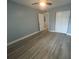 Bedroom with wood-look floors and ceiling fan at 2460 Canadian Way # 6, Clearwater, FL 33763