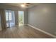 Bedroom with sliding door to patio and ensuite bathroom at 2460 Canadian Way # 6, Clearwater, FL 33763