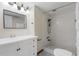 Bathroom featuring a white vanity, mirror, and tiled shower with black shower head at 3717 46Th S Ave # 6, St Petersburg, FL 33711