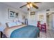 Cozy bedroom with a ceiling fan, closet, and adjoining bathroom with a serene and relaxing atmosphere at 3717 46Th S Ave # 6, St Petersburg, FL 33711