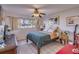 Bedroom with a wooden bed frame, ceiling fan, and water view at 3717 46Th S Ave # 6, St Petersburg, FL 33711