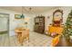 Bright dining room with tile flooring and casual seating, decorated with vintage furniture at 3717 46Th S Ave # 6, St Petersburg, FL 33711