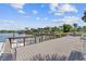 Beautiful waterfront dock with seating and panoramic views of the water, perfect for relaxing outdoors at 3717 46Th S Ave # 6, St Petersburg, FL 33711