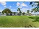Well-maintained condo with lush green lawn and tropical landscaping under a bright blue sky at 3717 46Th S Ave # 6, St Petersburg, FL 33711